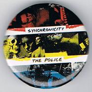 File:Synchronicity Andy red Sting yellow Stewart blue larger round button.jpg