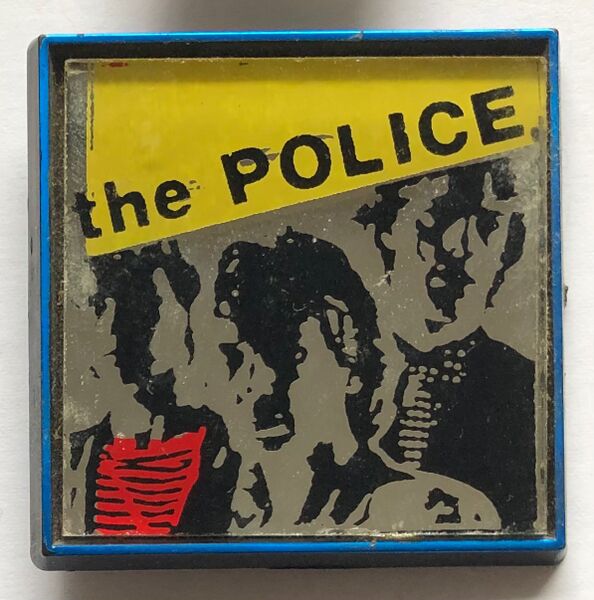 File:Reggatta LP large mirror metal badge.jpg