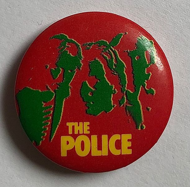 File:Reggatta LP green on red small button.jpg