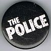 The Police Zenyatta logo round black button.jpg