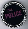 The Police round metal badge dark purple.jpg