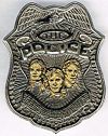 Faces metal badge.jpg