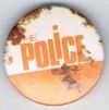 The Police white orange button.jpg