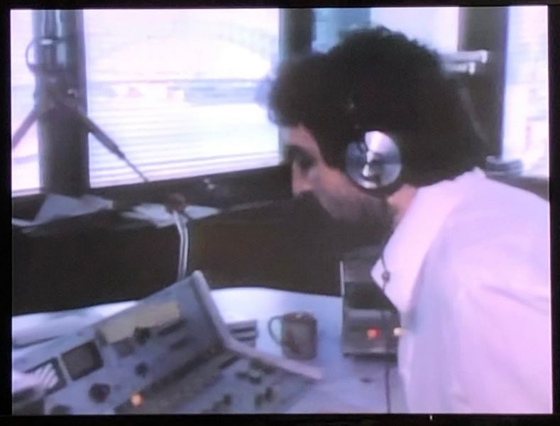 File:Around The World Man radio guy.jpg